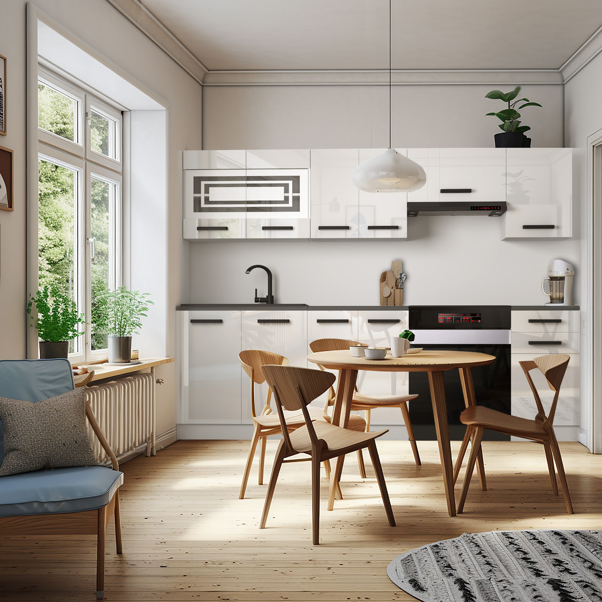 Cucina luminosa con mobili bianchi e dettagli in legno