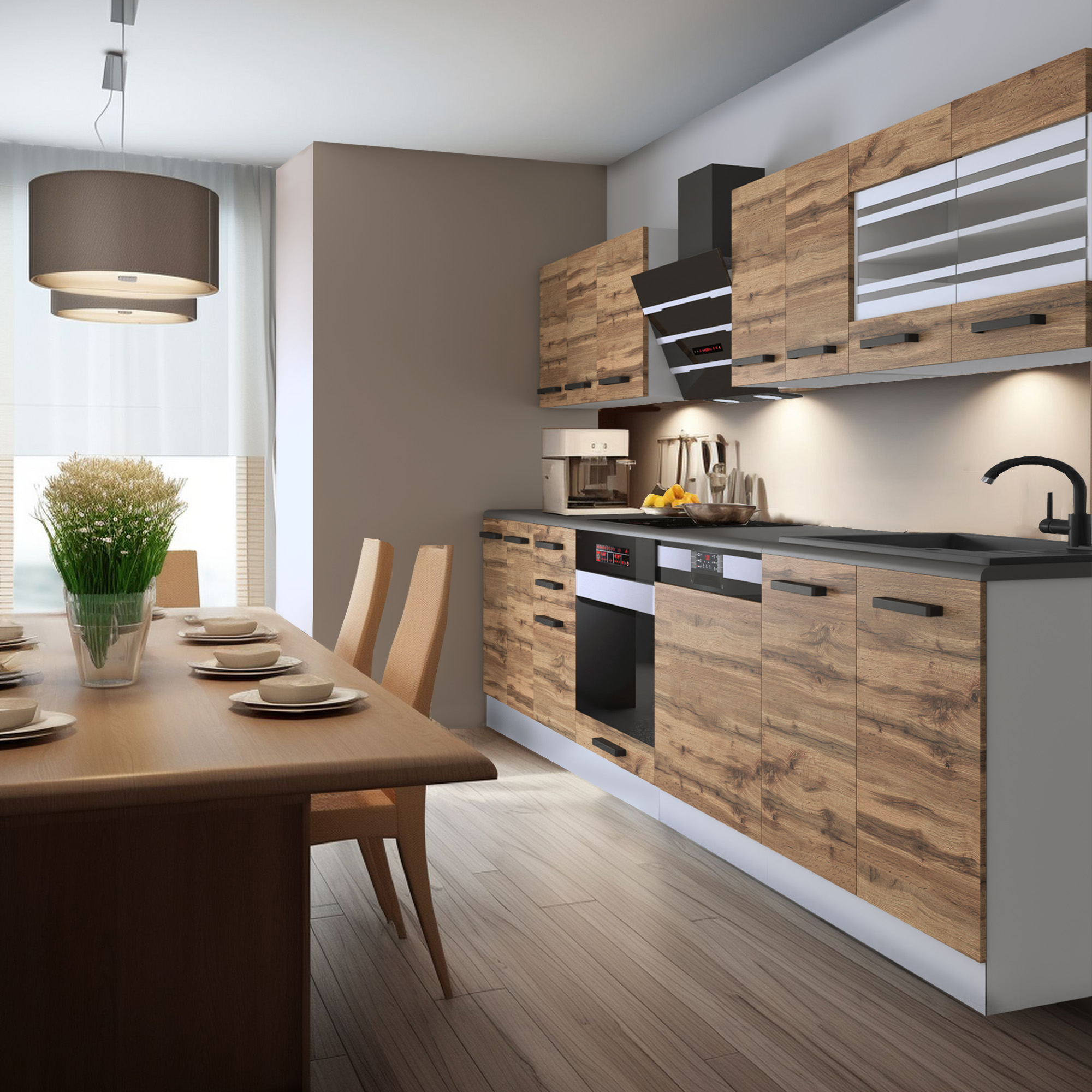 Cucina con mobili in legno chiaro e tavolo da pranzo